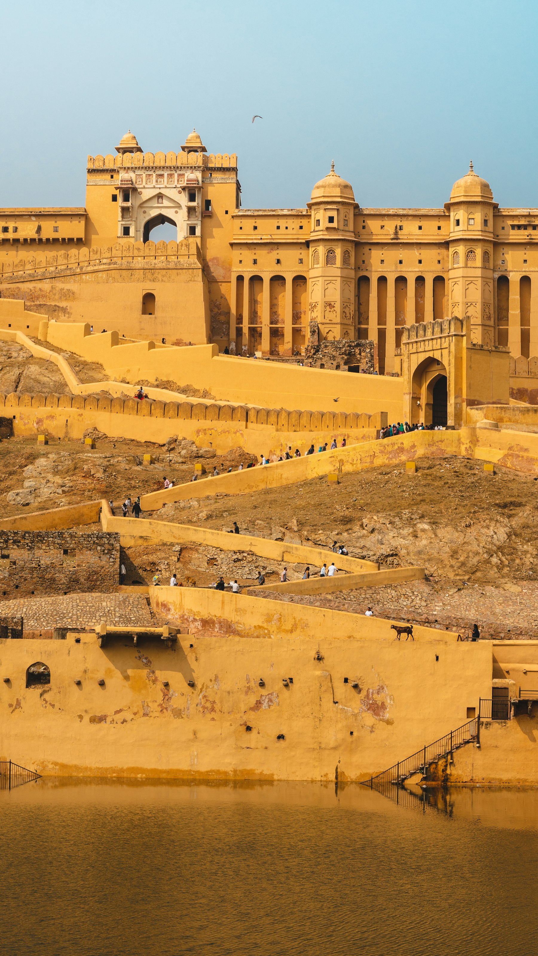 Amber Fort in Jaipur above sandstone ramparts and water