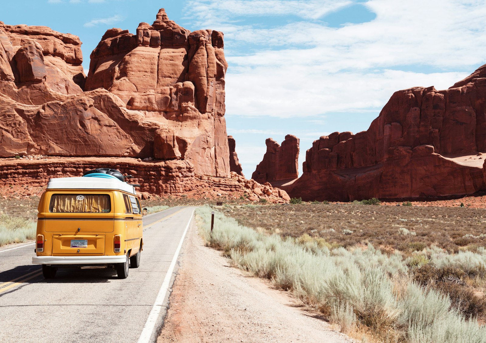 A camper van on an open desert highway